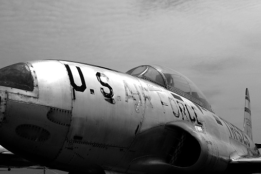 A scale model of the iconic B-17 Flying Fortress sitting on a scale model airfield. The B-17 was an American four-engined heavy bomber aircraft developed in the 1930s for the United States Army Air Corps and made by Boeing.