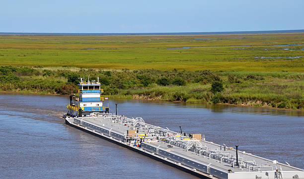 Oil barge pushed by tugboat stock photo