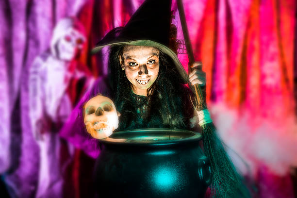 istock Halloween:  Witch cooking her brew for special guests. Zombie. Skull. 488813972