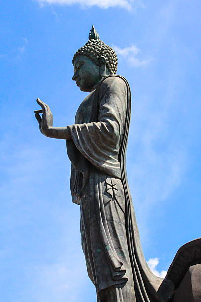 istock Image of Buddha in Phuttamonthon and  blue sky 488817192