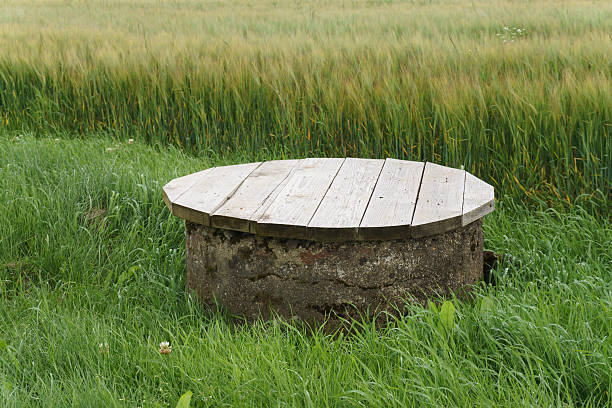 Agriculture drain well with cup stock photo