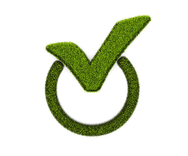 Green grassed check mark symbol in the circle on white stock photo