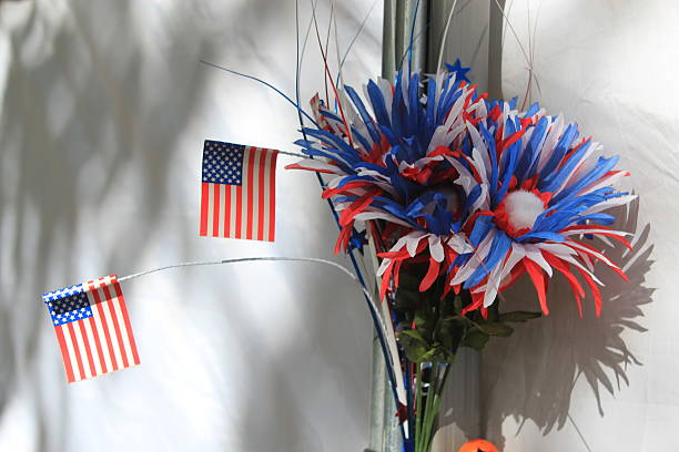 istock Patriotic American flowers and mini US flags 488823184