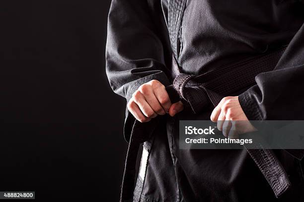 Tying The Knot To His Black Belt Stock Photo - Download Image Now - Martial Arts, Jujitsu, Karate