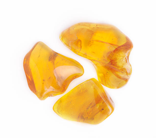 istock amber gemstone on white. Soft focus, photo toned 488824954