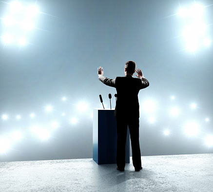 businessman standing on podium and closes on outbreaks
