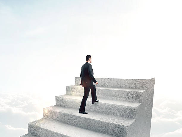 istock man climbing to stairs 488825712