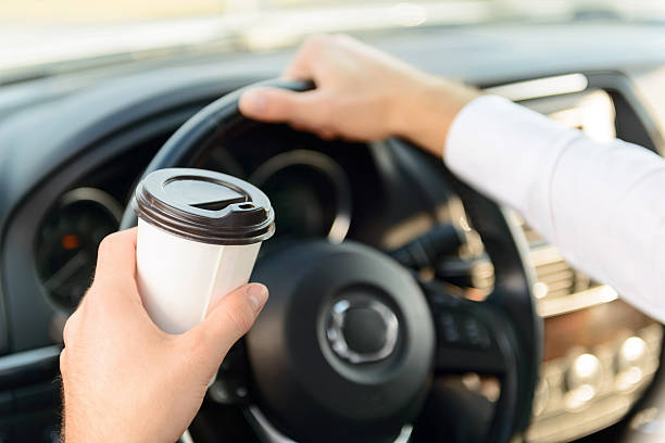 istock Pleasant businessman driving a car 488826110