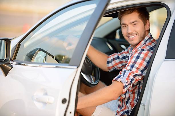 istock Upbeat boy sitting in the car 488826302