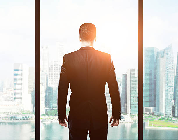 istock businessman standing in office 488827146