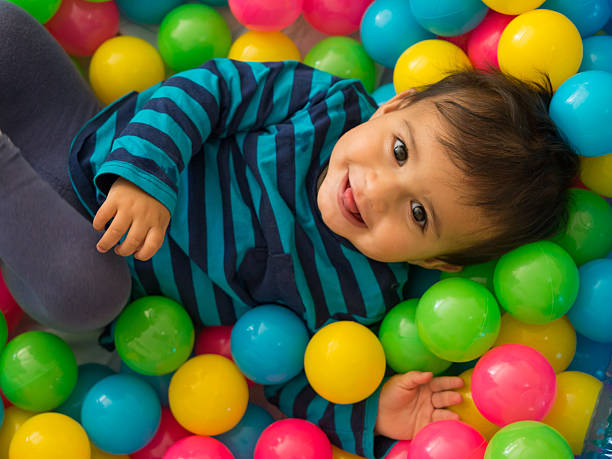 Baby in Ball Pool stock photo