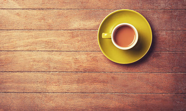 istock Cup of coffee on a wooden table. 488827241