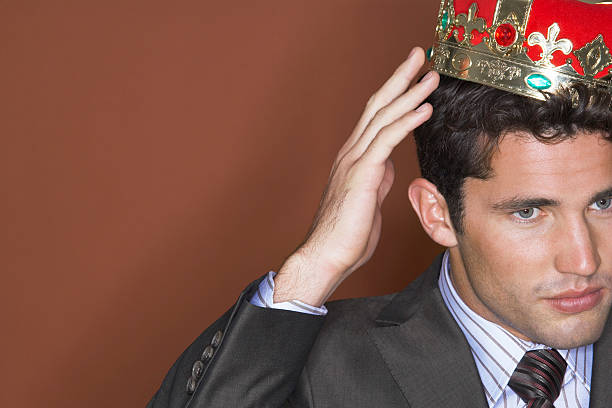 istock Businessman Putting On Crown 488828015