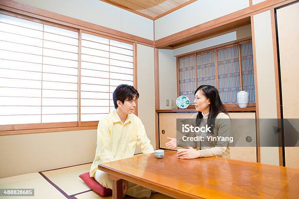 Japanese Family Couple Discussing Serious Subjects Stock Photo - Download Image Now - Married, Discussion, Talking