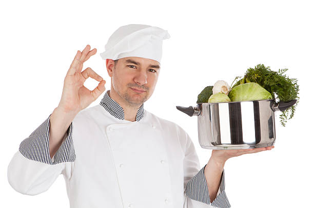 istock Chef with OK sign, holding pot and vegetables. 488830851