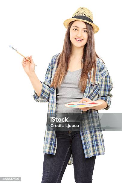 Female Artist Holding Paintbrush And Color Pallet Stock Photo - Download Image Now - One Woman Only, Paintbrush, Women
