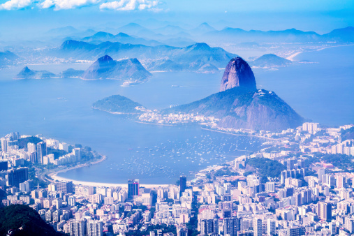 Aerial view of Rio de Janeiro with sugarloaf mountain and Guanabara Bay at background.