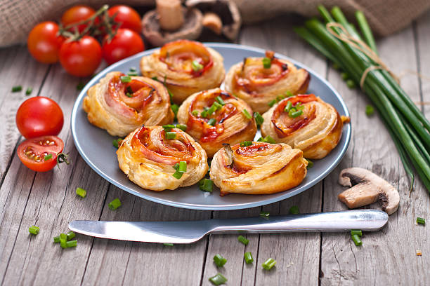 istock Puff pastry rolls with ham and chese. Baked snacks 488833103