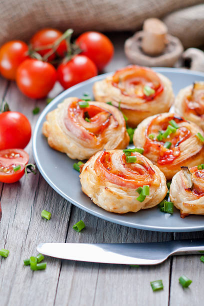 istock Puff pastry rolls with ham and chese. Baked snacks 488833143