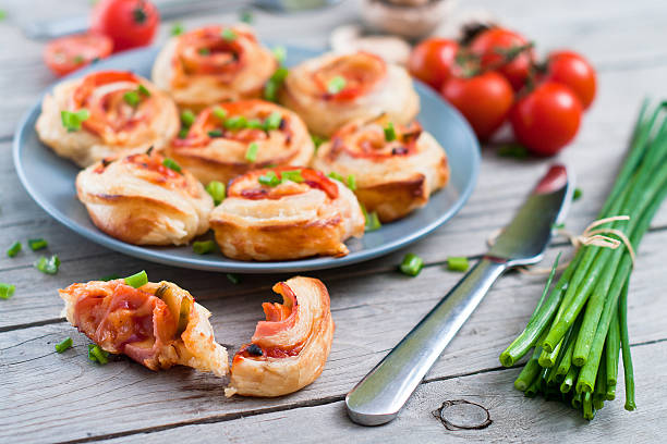 istock Puff pastry rolls with ham and chese. Baked snacks 488833149