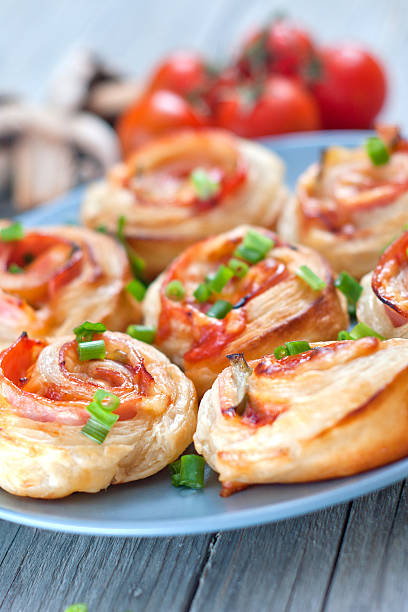 istock Puff pastry rolls with ham and chese. Baked snacks 488833173