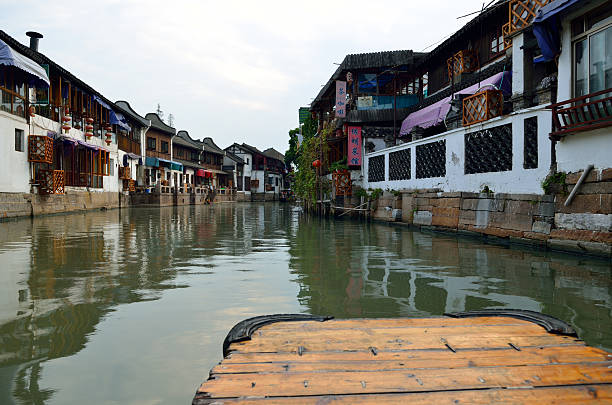 istock Old village by river in Shanghai with boat 488838668