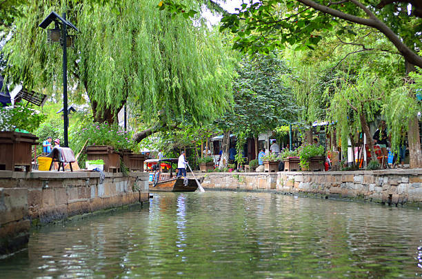istock Old village by river in Shanghai with boat 488839498