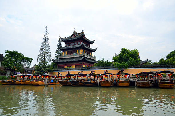 istock Old village by river in Shanghai with boat 488840126