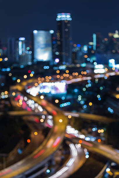 istock Abstract blurred bokeh city highway overpass 488840504