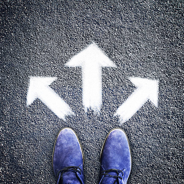 istock Man's shoes with three arrows directions, concept 488840784