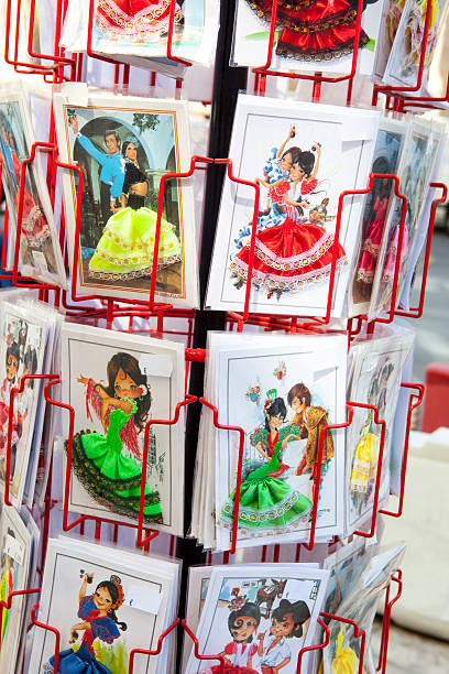 Malaga, Spain - September 10, 2015: roll sales stand for postcards with typical scenes of Andalusia, Malaga September 10, 2015. This postcards are made with pieces of fabrics of traditional gypsies dresses
