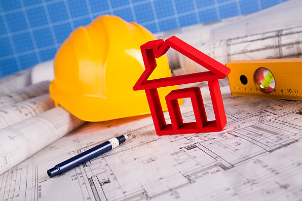 istock Hard hat with blueprints and rulers 488842382