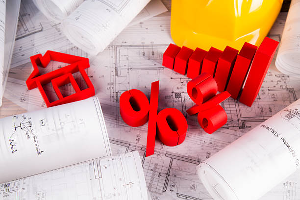 istock Architectural project and Yellow helmet and house model 488842798