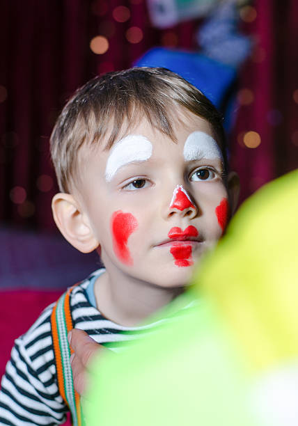 istock Cute Kid with Mime Makeup for Stage Play 488844360
