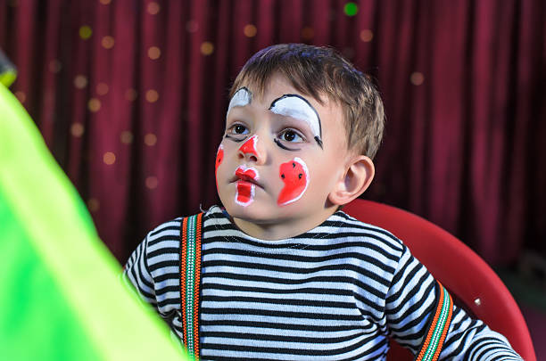 istock Cute Kid with Mime Makeup for Stage Play 488844452