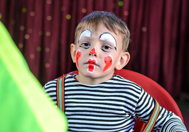 istock Cute Kid with Mime Makeup for Stage Play 488844498