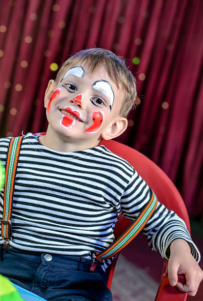 istock Cute Kid with Mime Makeup for Stage Play 488844536