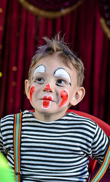 istock Cute Kid with Mime Makeup for Stage Play 488844574