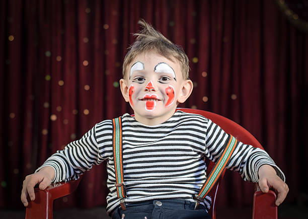 istock Cute Kid with Mime Makeup for Stage Play 488844600