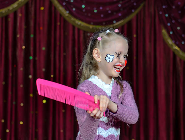 istock Laughing little girl in comic makeup 488845134