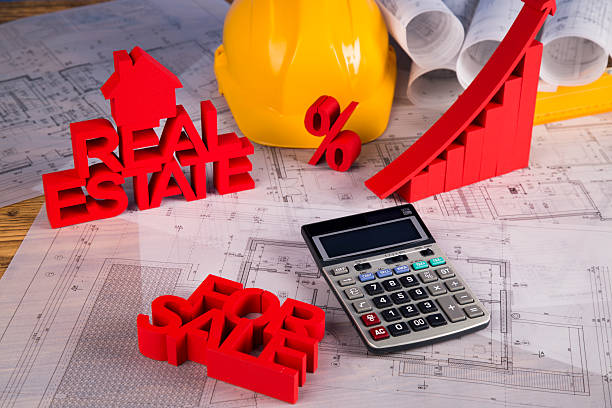 istock Architectural project and Yellow helmet and house model 488847206