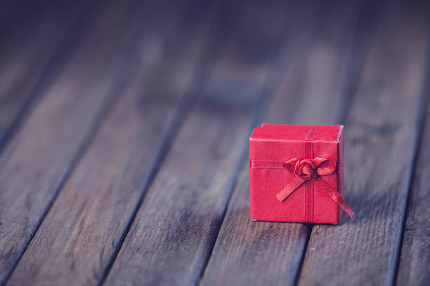 istock Christmas gift box on wooden table 488850891