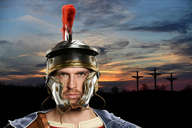 Portrait of Roman soldier with crossed in background at sunset