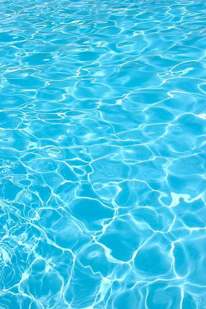 Water pool Rippling water in a pool. Bright blue water background turquois stock pictures, royalty-free photos & images