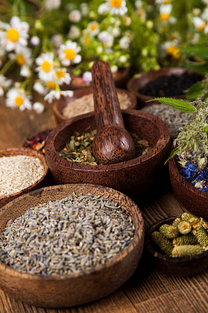 istock Natural remedy, mortar and herbs 488852222