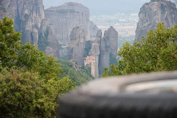 landrover defender camping in greece with view to meteora monastery