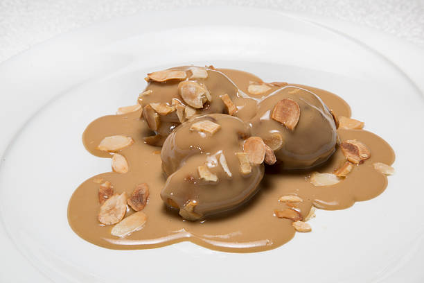 istock plate of dessert with sauce ,profiterole 3 488853323