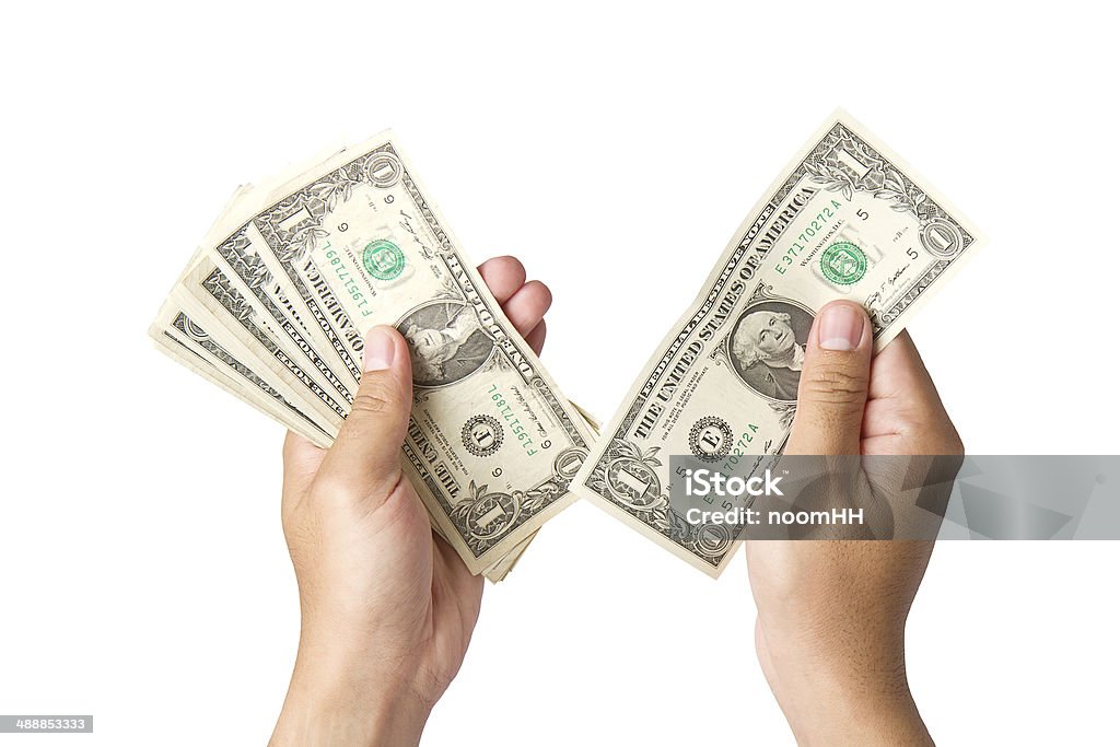 Handling us money, one  dollar bills on a white background Banking Stock Photo