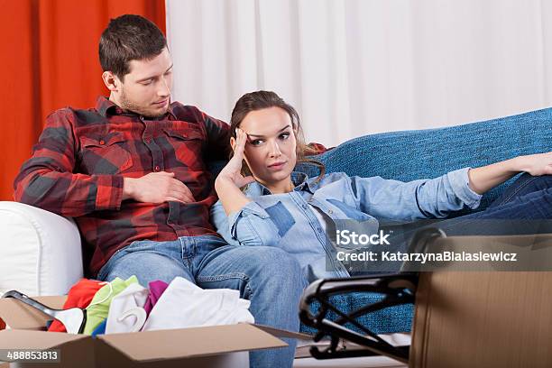 Tired Couple Because Of Moving House Stock Photo - Download Image Now - Adult, Apartment, Box - Container
