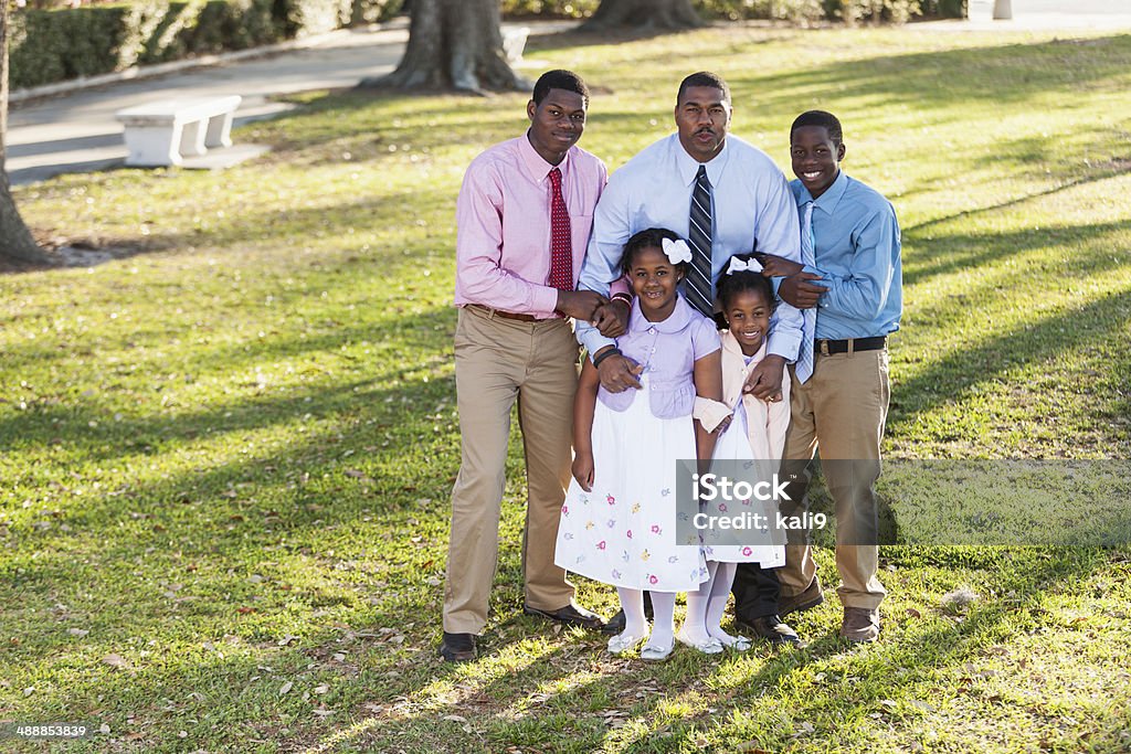 African American father with four children Portrait of African American father (40s) with four children (5, 7, 13 and 17 years). African Ethnicity Stock Photo